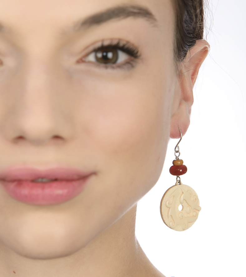 Woman Wearing Bali Ivory and Carnelian Earrings