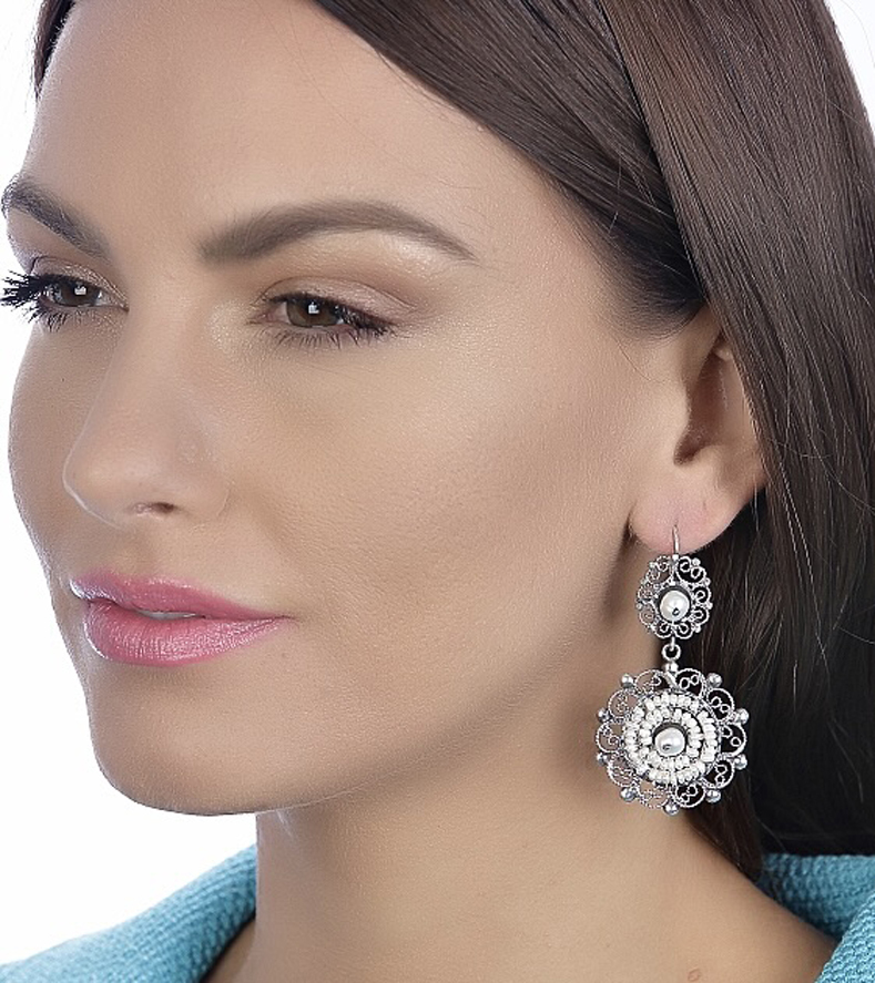 Woman Wearing Rising Mexican Sterling and Pearl Earrings