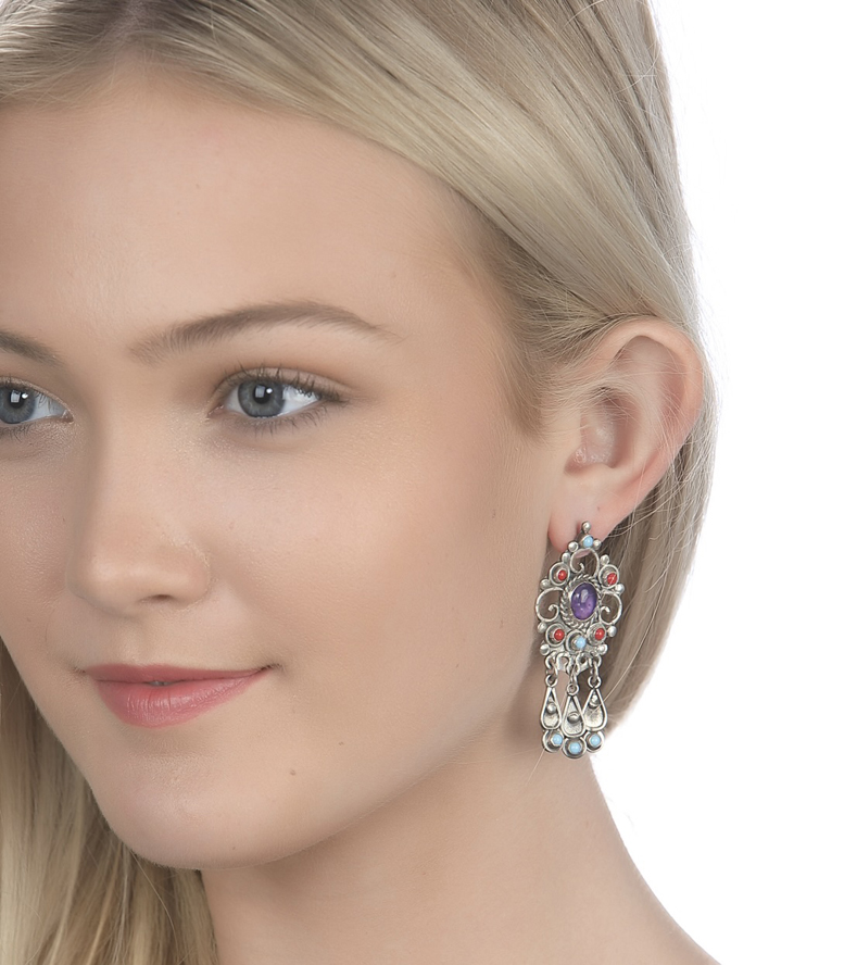 Woman Wearing Putting on Turquoise Coral and Amethyst Earrings