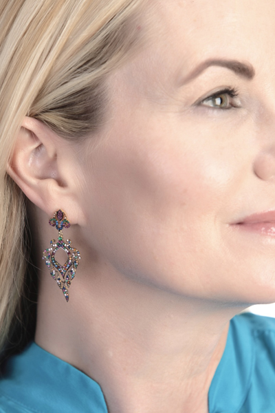 Woman Wearing Teardrops of Stones in Earrings