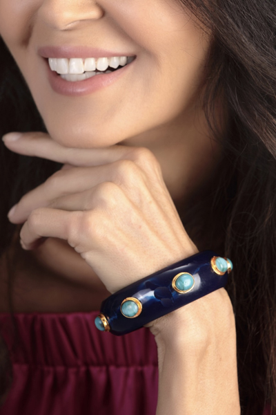 Woman Wearing Navy Blue and Turquoise French Bracelet