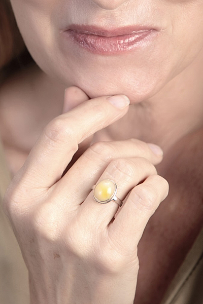 Woman Wearing Yellow Opal Ring
