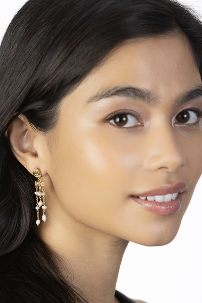 Woman Wearing Pearl Dangle Earrings