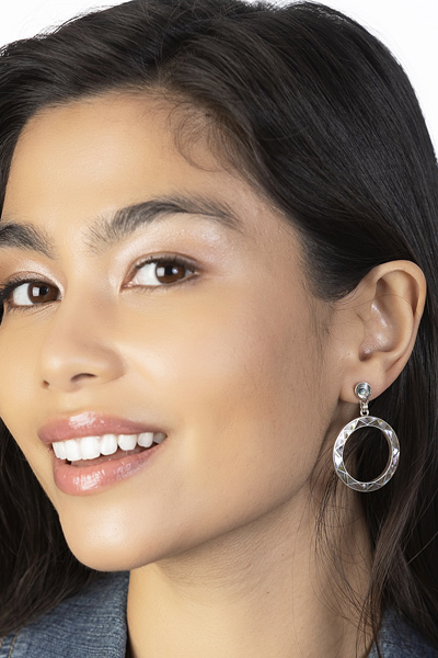 Woman Wearing Abalone Shell Earrings from Peru