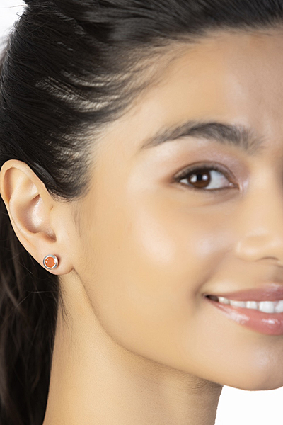 Woman Wearing Carnelian Stud Earrings