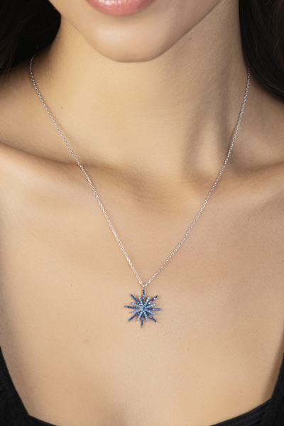 Woman Wearing Crystal Blue and Sterling Star necklace