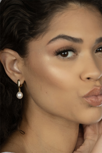 Woman Wearing Pearl Drop Italian Earrings