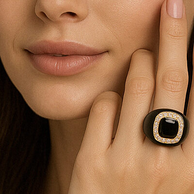 Woman Wearing Black Enamel and Stone Ring