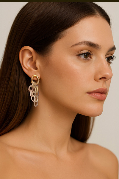 Woman Wearing Small Cascading white horn Italian Earrings