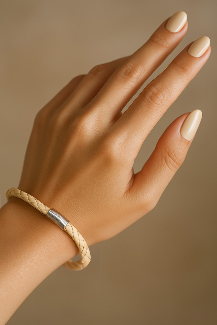 Female Hand Wearing Cream Leather German Bracelet