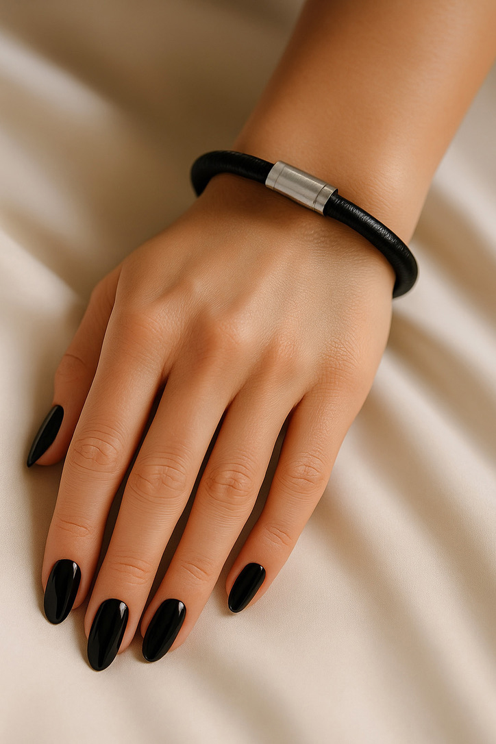 Female Hand Wearing Black Leather German Bracelet