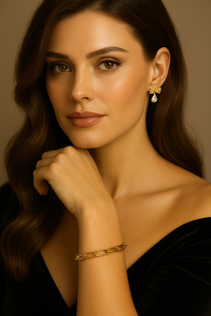 Woman in Black Dress Wearing Gold Link Bracelet