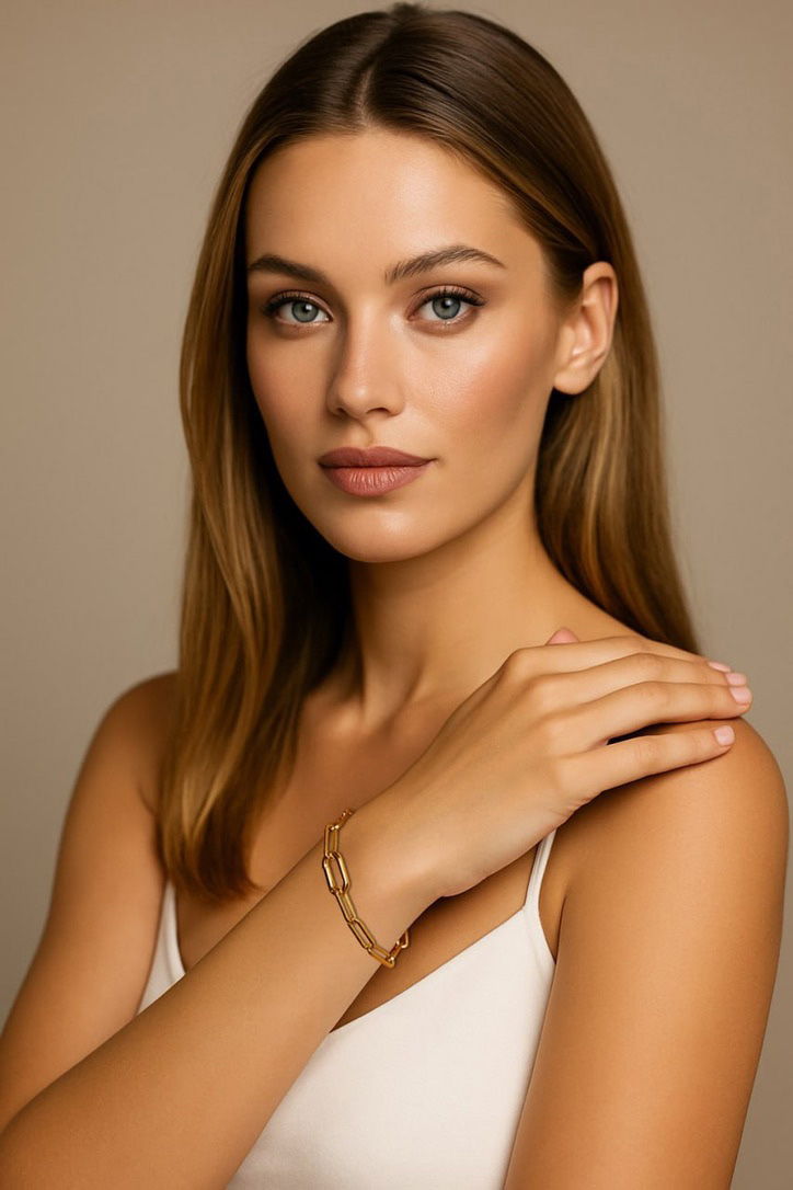 Woman in White Dress Wearing Gold Link Bracelet