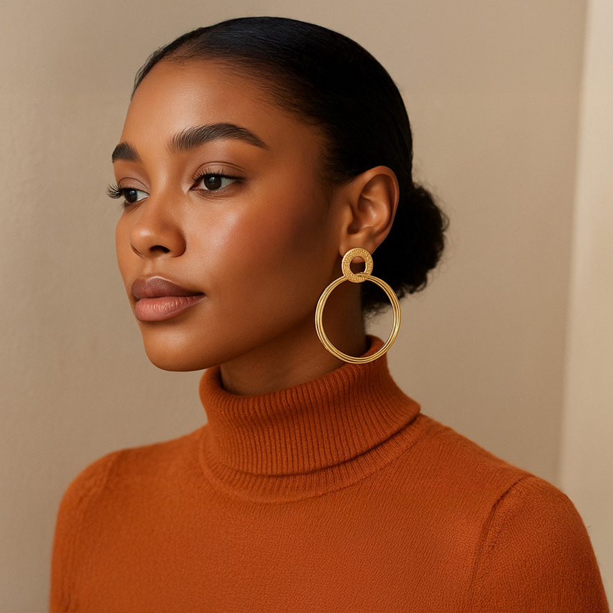 Woman Wearing Large Gold hanging Hoop Earrings