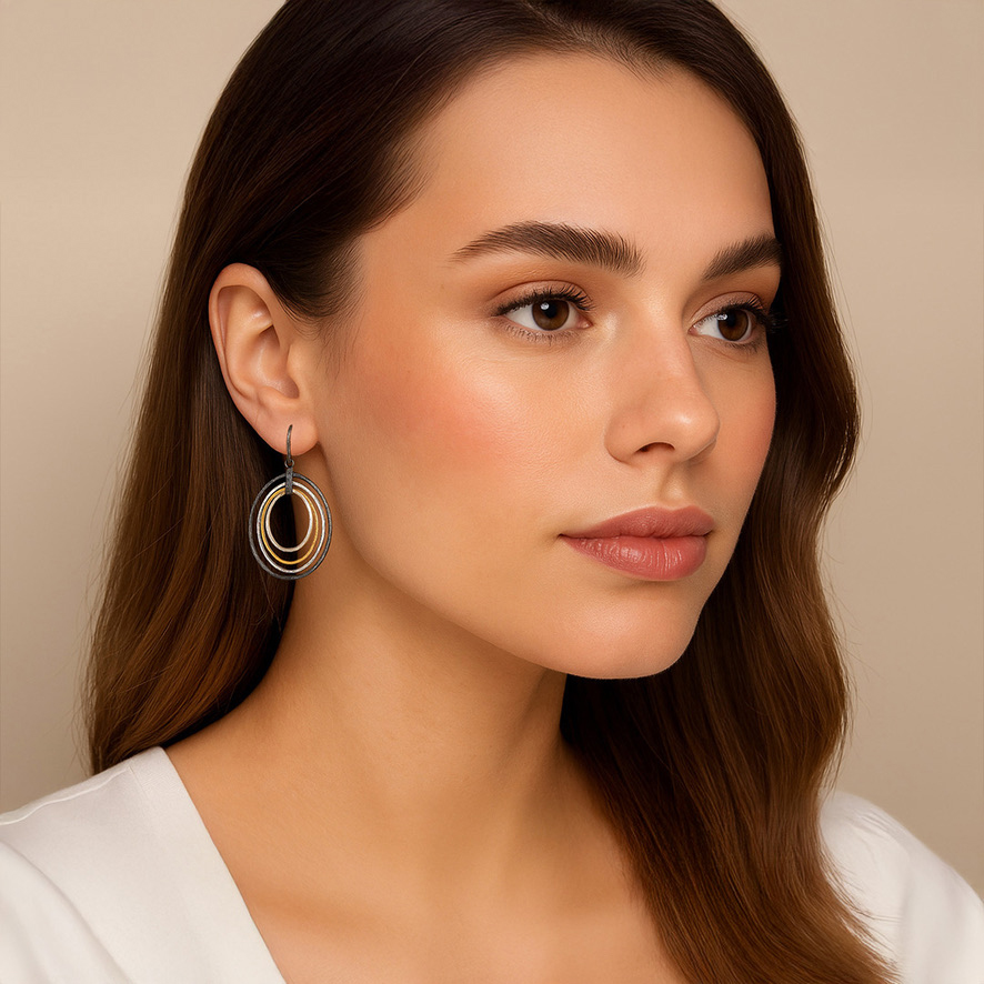 Woman Wearing Oval Circles Cascade in Dutch Earrings