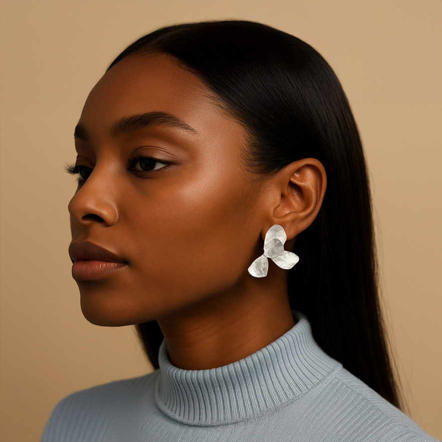 Woman Wearing Sterling Silver Flowered Earrings