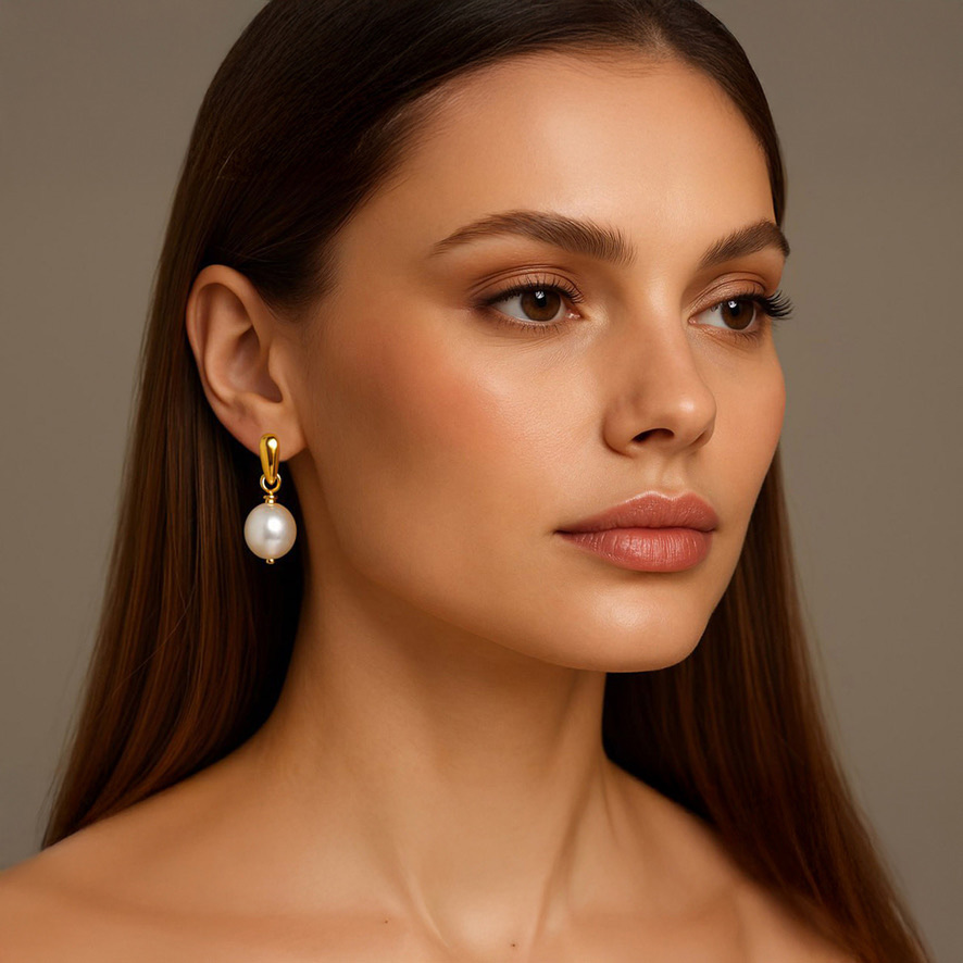 Woman Wearing Italian Baroque Pearl Earrings