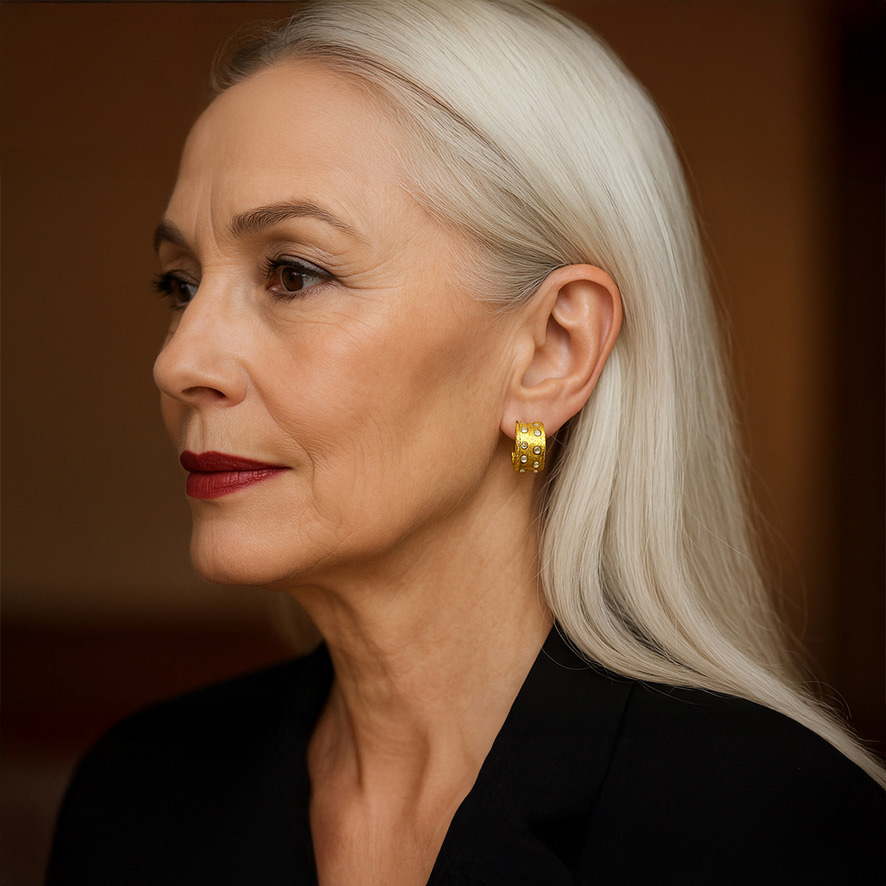 Woman Wearing Gold and Mother of Pearl Hoops