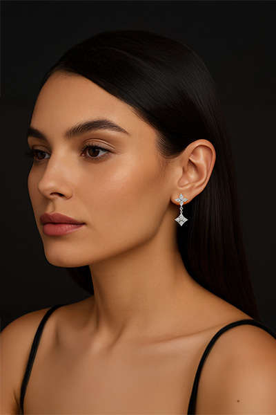 Woman Wearing Hanging Quatrefoil Earrings