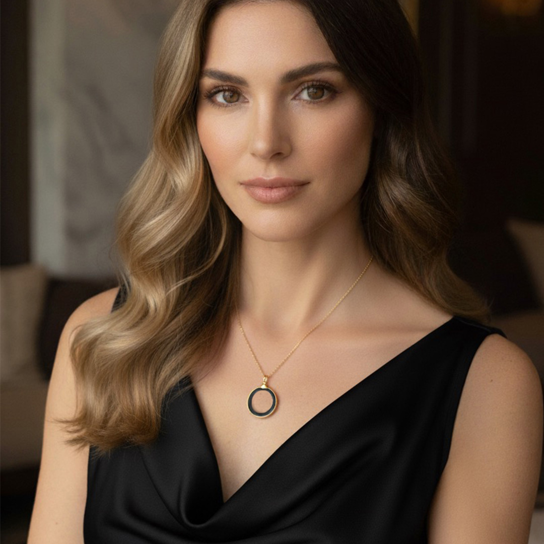 Woman Wearing Black Onyx and Gold Medallion Necklace