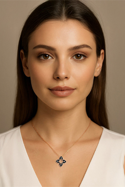 Woman Wearing Rose Gold and Black Quatrefoil Necklace